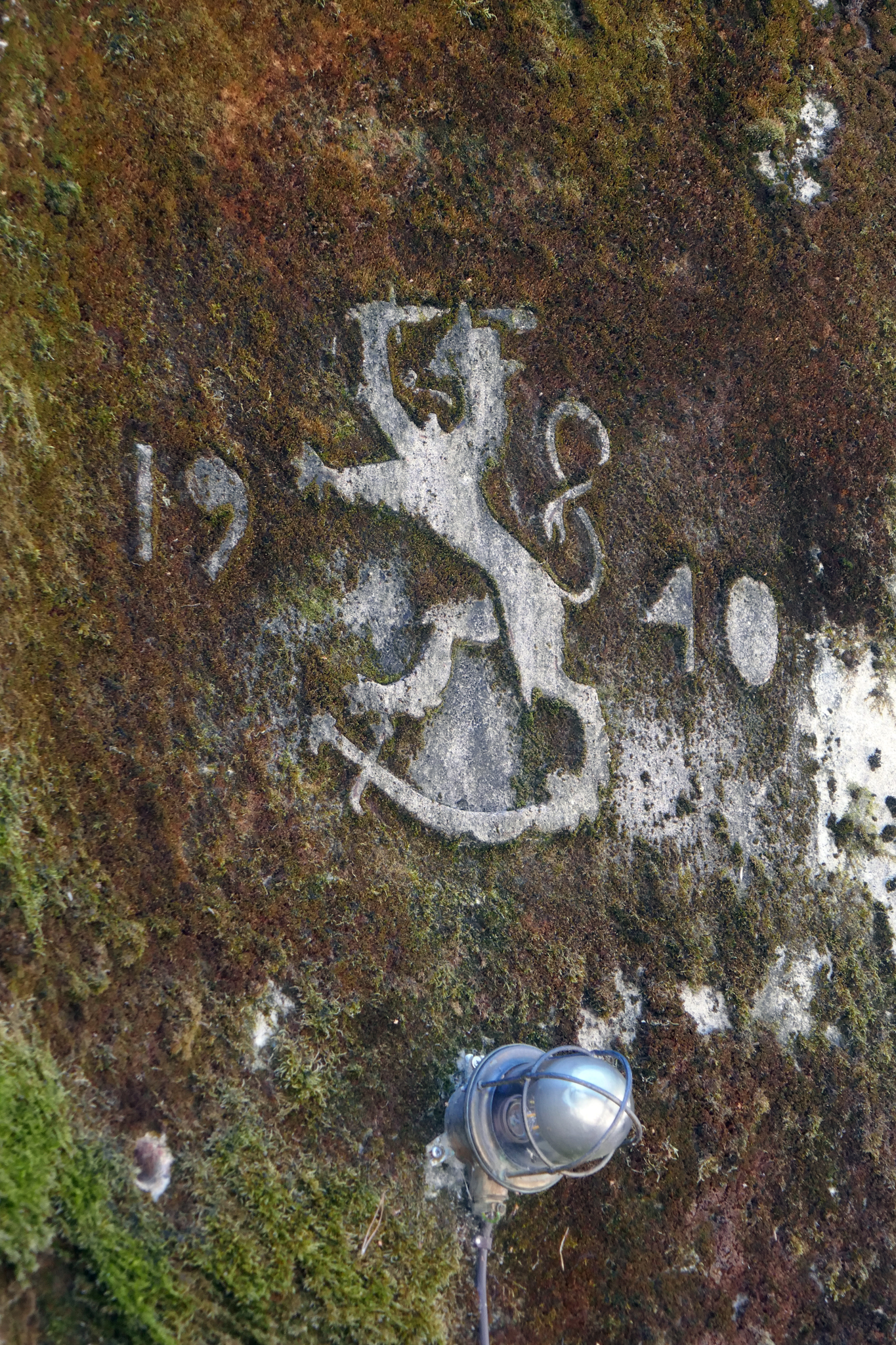 This is the Finnish coat of arms together with the year that the bunker was built, above its entrance door.